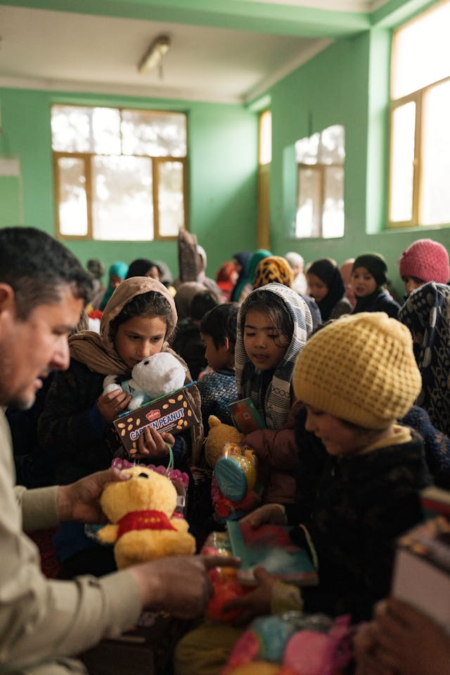 Children Receiving Toys in Afghan Classroom